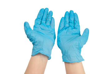 Woman puts on blue rubber gloves.