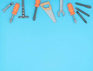 Kids set of working tools on blue background. Father day,  construction industry,  building and repair concept. Flat lay style with copy space for text.
