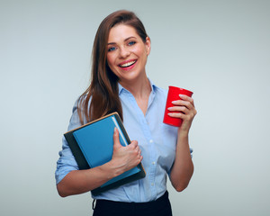 Woman teacher holding books relax with coffee cup.