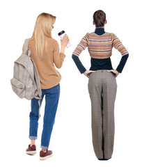 Back view of two woman in sweater.