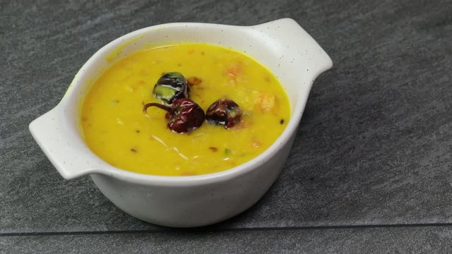 Cooking Pulses or lentils for Daal Tadka, an Indian lentils soup dish.