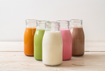  Thai milk tea, matcha green tea latte, coffee, chocolate milk, pink milk and fresh milk in bottle