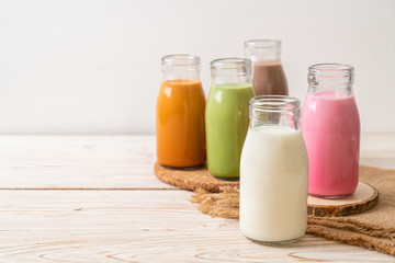  Thai milk tea, matcha green tea latte, coffee, chocolate milk, pink milk and fresh milk in bottle