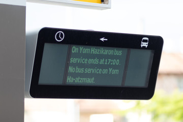 An electronic sign that updates public transit times. Changing transportation times on Memorial Day and Independence Day because of the Corona curfew