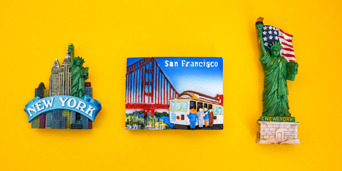 USA with magnets from new york and san francisco on yellow background, travel destination