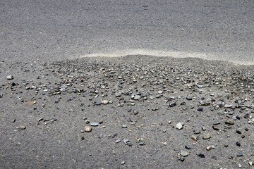 Gravel on the asphalt road