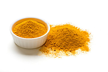 Orange dried turmeric, curcumin , yellow ginger powder in white glass bowl isolated on white color background, Used for cooking, natural dye and as herbal medicine