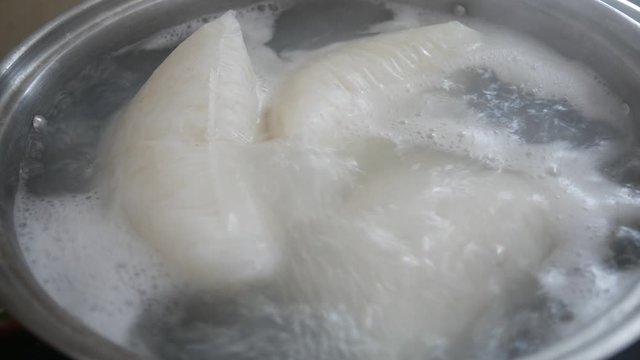 Nasi Impit or pressed rice in the plastic pack is boiled using hot water in a pan. Nasi Impit is usually cooked by Malay Muslims during Eid Celebration in Malaysia.