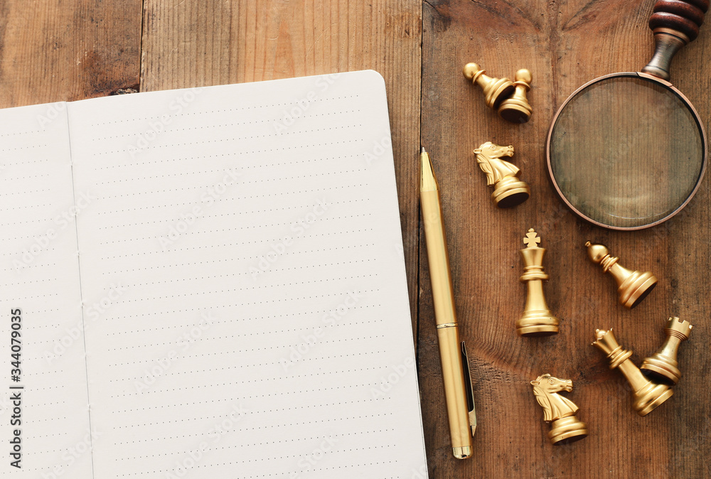 Fototapete top view image of open notebook with blank pages on wooden table. ready for adding text or mockup