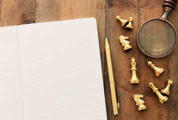 top view image of open notebook with blank pages on wooden table. ready for adding text or mockup