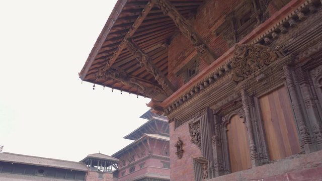 Patan Durbar Square - Magnificent Ancient Architectural Design - Kathmandu Nepal - Tilted panning shot