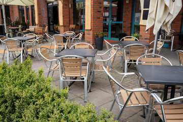 Empty street café in a tourist resort, forbidden to open due to the coronavirus pandemic crisis, financial disaster for the gastronomy business