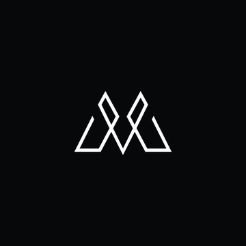 Minimal elegant monogram art logo. Outstanding professional trendy awesome artistic M MV VM initial based Alphabet icon logo. Premium Business logo White color on black background