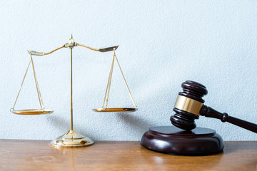 Image of Golden scales of justice and gavel for lawyer courtroom on the desk