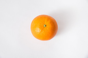 Top view of whole orange fruit isolated on white background. Single object, closeup. Natural vitamin or organic food concept