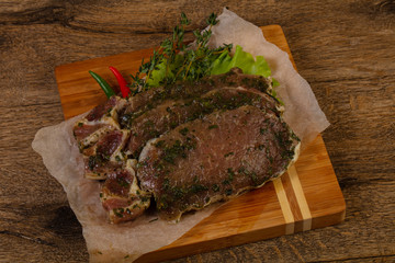 Raw marinated pork steak