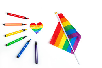 Mockup made with the LGBT pride flag with the heart coloured in LGBTQ pride colours. Concept of the Pride day, Valentine day, freedom, love. Flat lay, top view, template, overhead