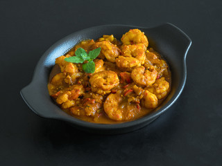 Hot spicy prawn curry. Shrimp in curry sauce in the pan