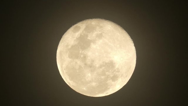 Zoom In Epic Footage Of Full Moon In Movement. Close Up Video Of A Big Glowing Yellow Moon.