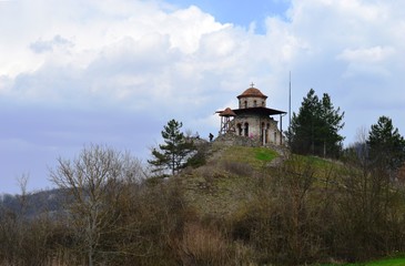 a small orthodox church on a hill