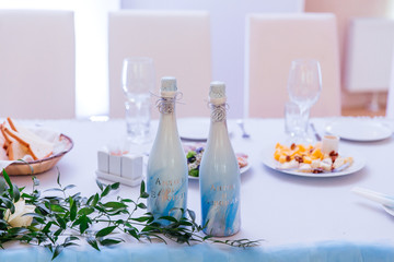 wedding decor and floristry, visiting ceremonies, details, champagne bottles, candles


