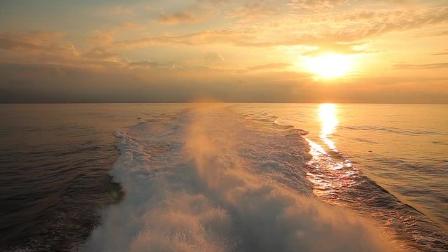 A ferry heading to the island of Roatan in the sunset. Honduras