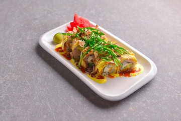 Fresh maki and nigiri sushi rolls with tuna fish and cheese. Asian Japanese cuisine concept.