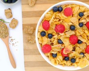 cereal in a white bowl on white background. Healthy breakfast concept.