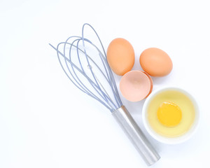 Close-up view of raw chicken eggs on white background