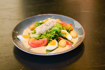 Tasty healthy breakfast with carpaccio meat, boiled eggs, corn, tomatoes and fresh salad. Healthy food.