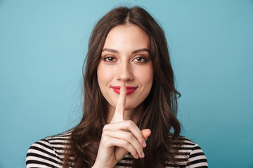 Naklejka premium Photo closeup of pleased nice woman gesturing silence sign