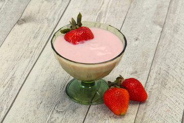 Yoghurt with strawberry in the bowl