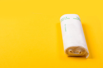 Biodegradable package isolated on the yellow backround. Eco friendly.
