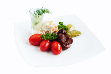 Pickled vegetables - cucumber, tomato and cabbage isolated on white. Preserved food