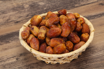 Sweet tasty dry dates in the basket