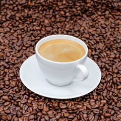 cup of coffee with beans
