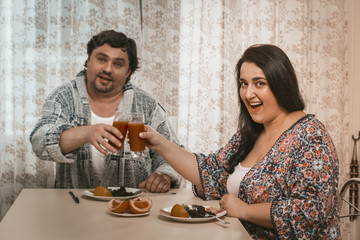 Cheerful Couple Clinking Glasses going to eat healthy food