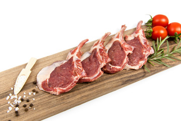 The white background is fresh lamb ribs on the serving table
