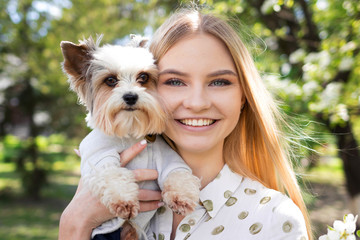 Large portrait of a beautiful girl with her dog, friendship between dog and man