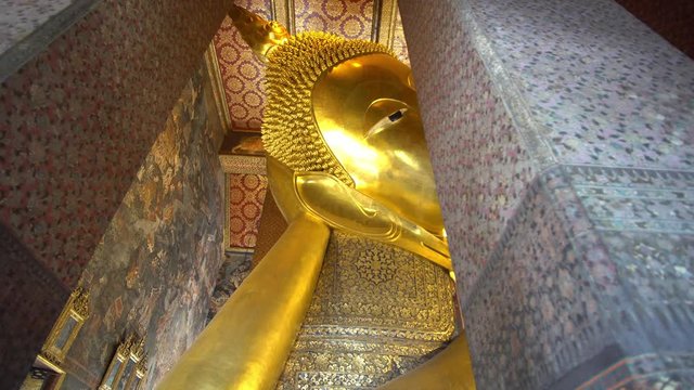 Reclining Buddha Golden Sculpture in Wat Pho Temple, Bangkok Thailand, Trucking Close Up