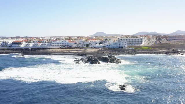 Waves hitting Coast of Corralejo Fuerteventura on Balearic Islands shot with Aerial Drone