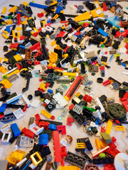 Many small parts from Bricks. Lots of colorful toy bricks. The background is from Bricks.