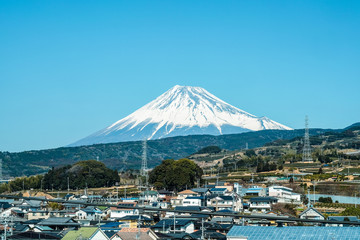 Mount Fuji is the background of the village on the way.