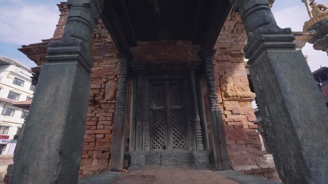 Amazing Red Brick Architecture And Intricate Wooden Carvings Of A Temple In Patan Durbar Square, Nepal - panning shot 