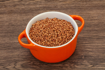 Raw buсkwheat cereal in the bowl