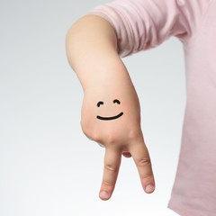child hand with funny face