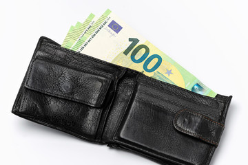 black leather men's wallet and several banknotes of 100 euros on a white background