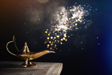 Genie appearing from magic lamp of wishes. Fairy tale