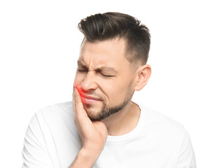 Fototapeta premium Man suffering from toothache on white background
