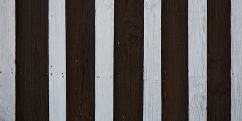 White and dark brown wooden board wall striped black background of wood plank